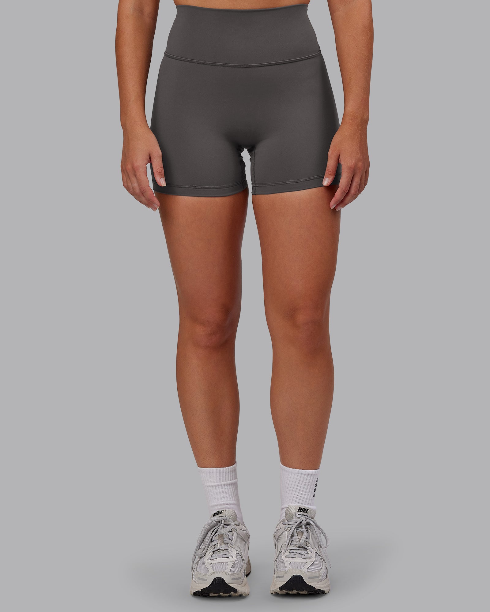 Woman wearing Fusion Ultra High-Rise 4" Short - Dark Storm | Model:Hannah | Size:S