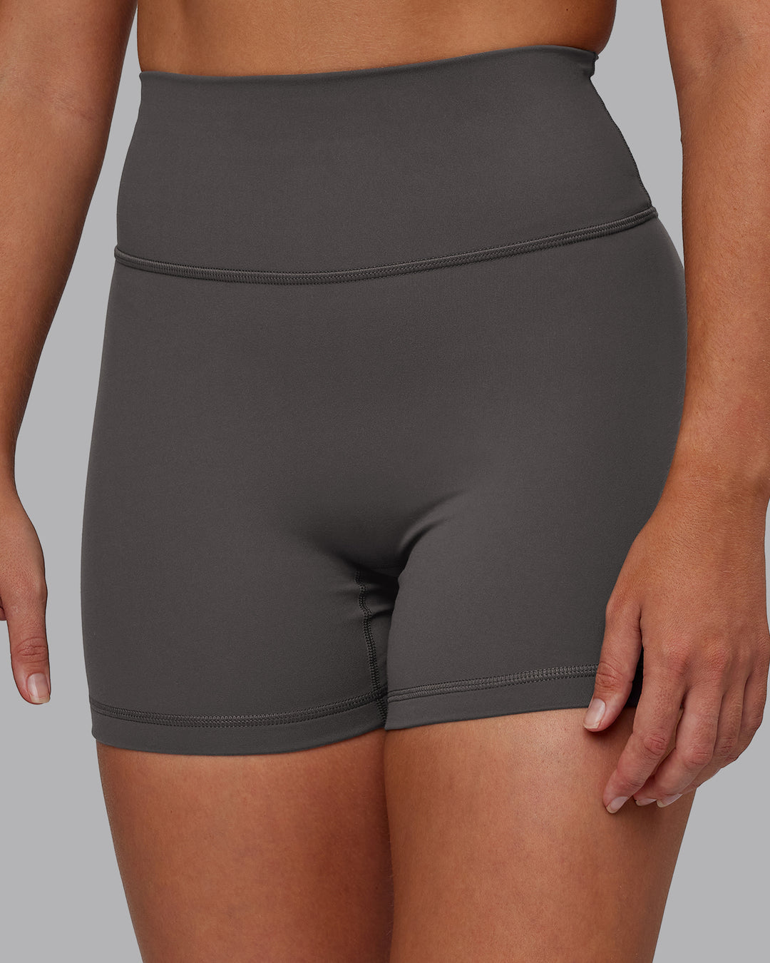 Woman wearing Fusion Ultra High-Rise 4&quot; Short - Dark Storm | Model:Hannah | Size:S