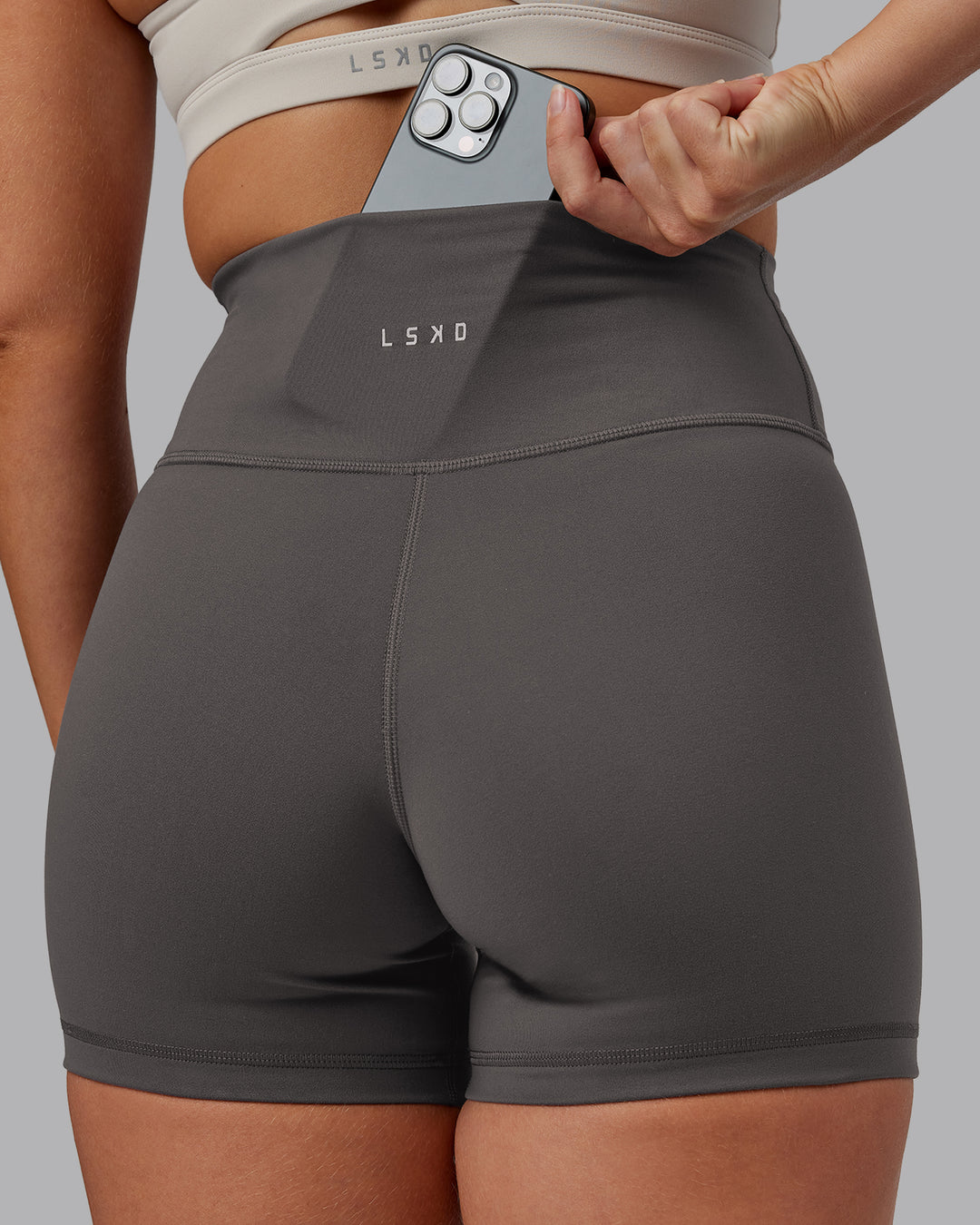 Woman wearing Fusion Ultra High-Rise 4&quot; Short - Dark Storm | Model:Hannah | Size:S