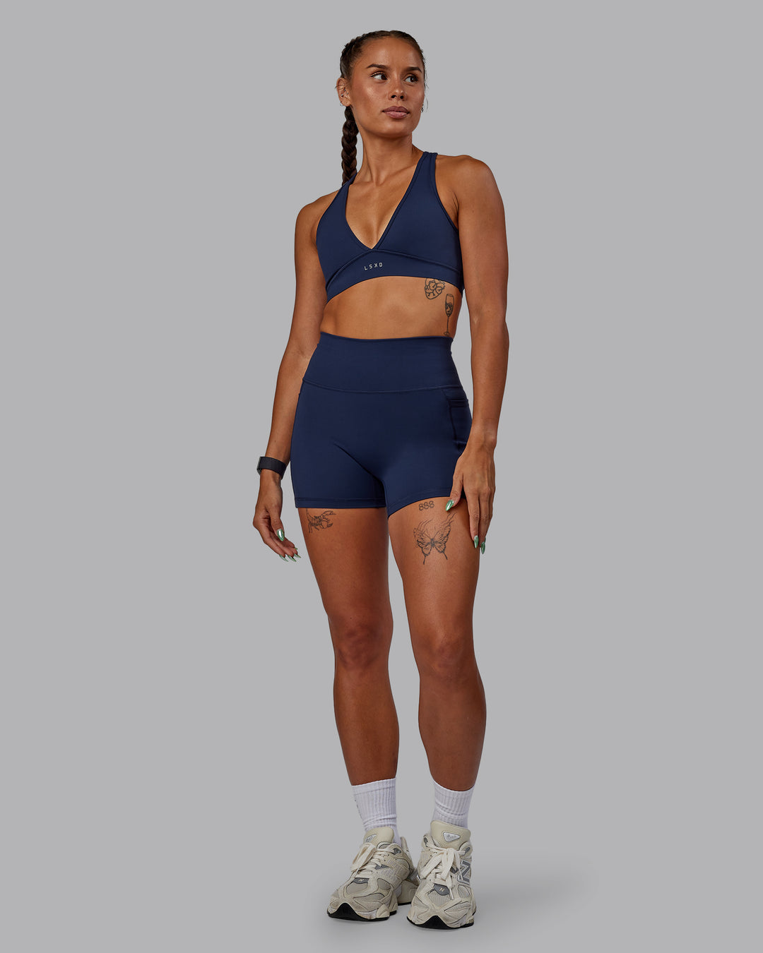 Woman wearing Fusion Ultra High-Rise 4&quot; Short Pockets - Future Navy | Model:Vanessa | Size:S