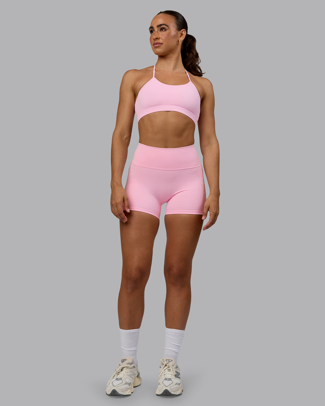 Woman wearing Fusion Ultra High-Rise 4" Short Pockets - Pale Pink | Model:Sophie | Size:S