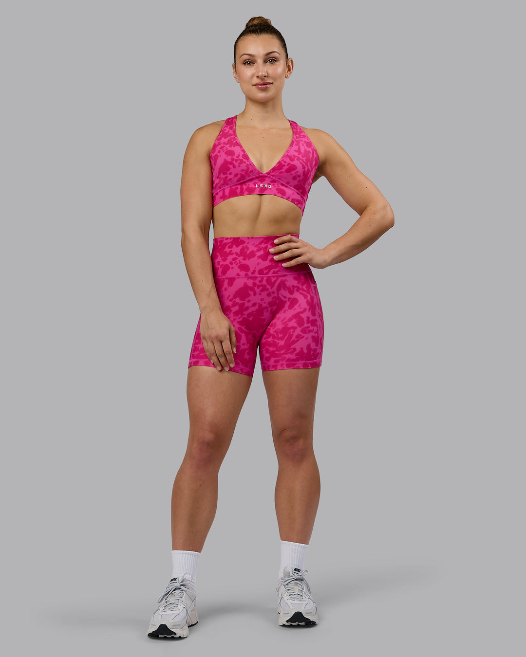 Woman wearing Fusion Ultra High-Rise 4&quot; Short Pockets - Strawberry-Lava Lamp | Model:Zoe | Size:S