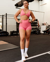 Woman wearing Fusion Ultra High-Rise 4" Short Pockets - Pink Lemonade | Model:Charlotte | Size:S