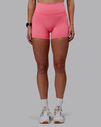 Woman wearing Fusion Ultra High-Rise 4" Short Pockets - Pink Lemonade | Model:Shae | Size:S