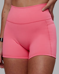 Woman wearing Fusion Ultra High-Rise 4" Short Pockets - Pink Lemonade | Model:Shae | Size:S