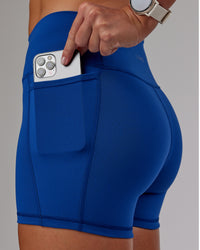 Woman wearing Fusion Ultra High-Rise 4" Short Pockets - Blue Quartz | Model:Phoebe | Size:S