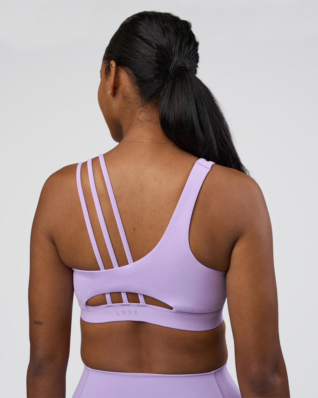 Woman wearing Galvanise Splice Sports Bra - Pale Lilac | Model:Rica | Size:S