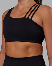 Woman wearing Galvanise Sports Bra 2.0 - Black | Set:true | Angle:closeup | Model:Phoebe | Size:S