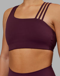 Woman wearing Galvanise Sports Bra 2.0 - Cherry Lacquer | Model:Keisha | Size:S