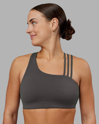 Woman wearing Galvanise Sports Bra 2.0 - Dark Storm | Set:true | Angle:front | Model:Keisha | Size:S