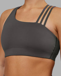 Woman wearing Galvanise Sports Bra 2.0 - Dark Storm | Set:true | Angle:closeup | Model:Keisha | Size:S