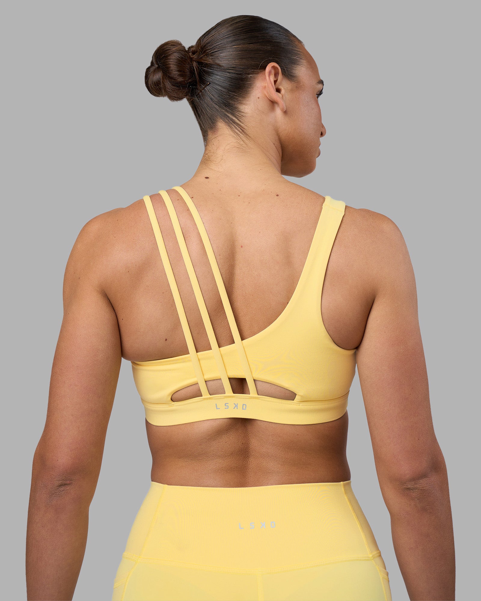 Woman wearing Galvanise Sports Bra 2.0 - Lemon | Model:Sophie | Size:S
