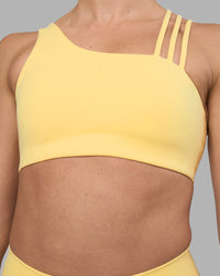 Woman wearing Galvanise Sports Bra 2.0 - Lemon | Set:true | Angle:closeup | Model:Sophie | Size:S