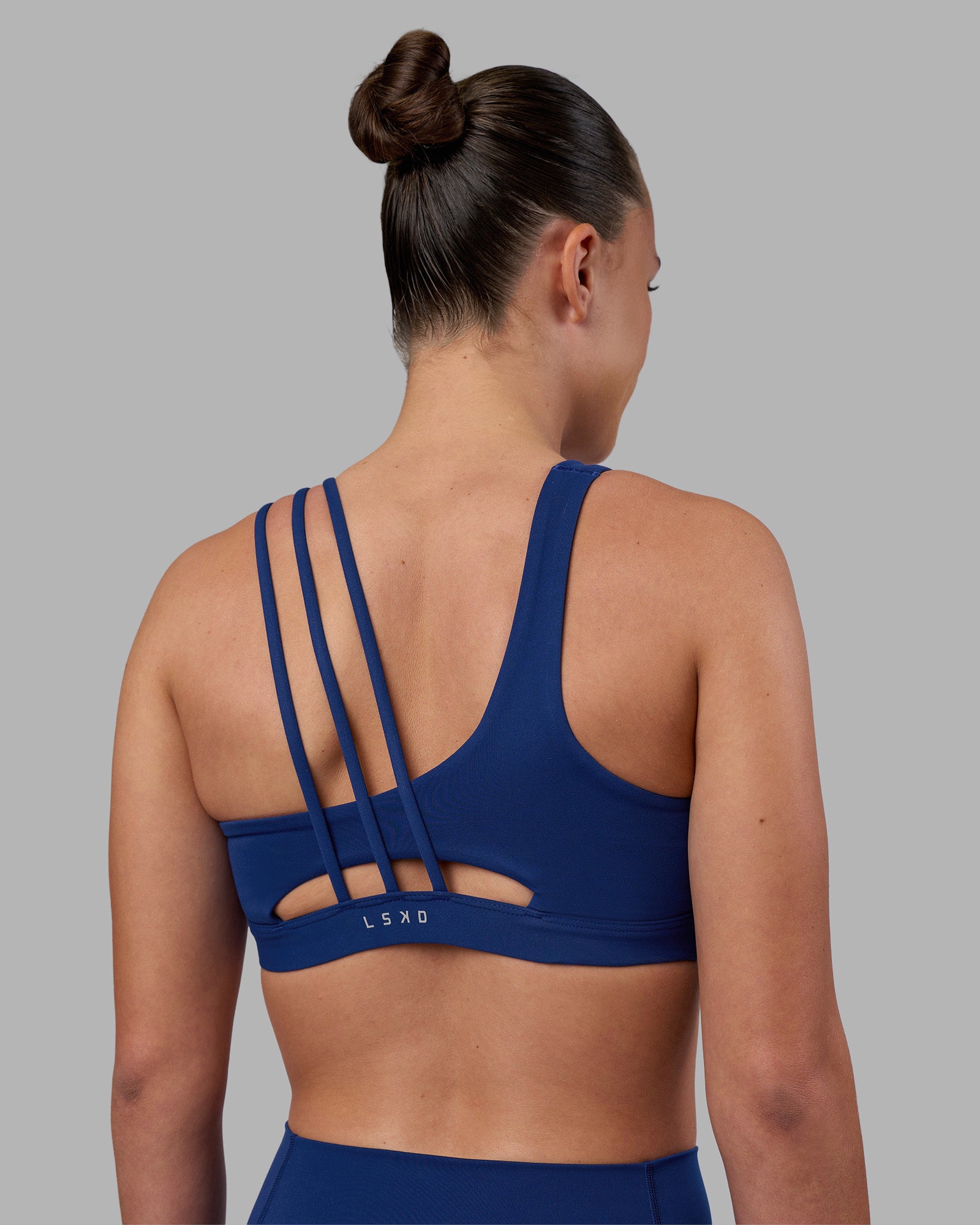 Woman wearing Galvanise Sports Bra 2.0 - Midnight Blue | Model:Charlize | Size:S