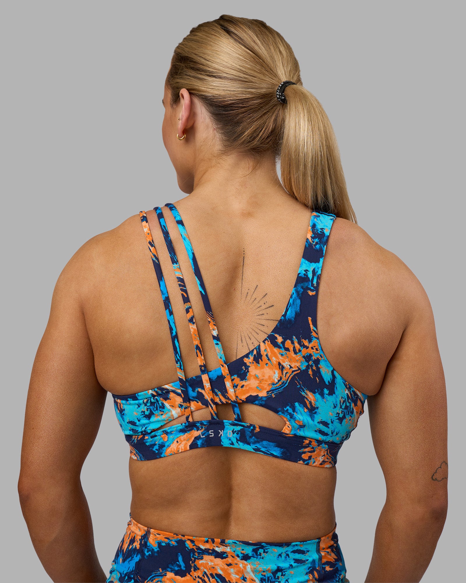 Woman wearing Galvanise Sports Bra 2.0 - React Print | Model:Georgia | Size:S