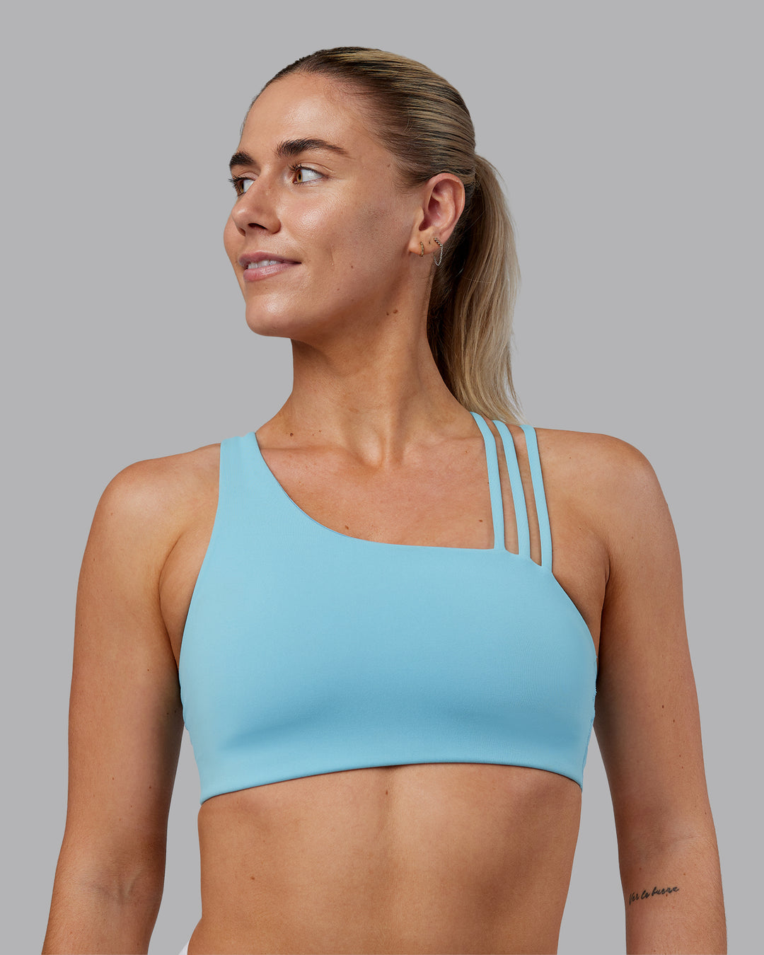 Woman wearing Galvanise Sports Bra 2.0 - Retro Blue | Model:Hannah | Size:S