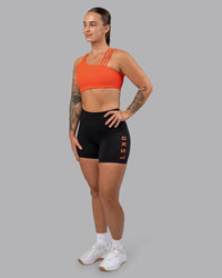 Woman wearing Galvanise Sports Bra 2.0 - Ultra Orange | Model:Robyn | Size:S