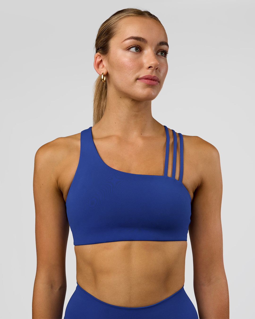 Woman wearing Galvanise Sports Bra 2.0 - Electric Indigo | Model:Evie | Size:S
