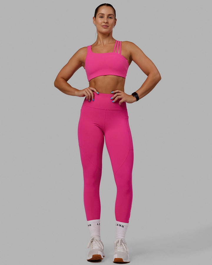 Woman wearing Galvanise Sports Bra - Ultra Pink