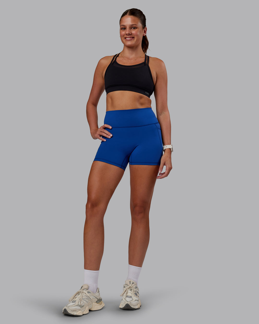 Woman wearing Genesis Layered Sports Bra - Black | Model:Phoebe | Size:S