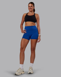 Woman wearing Genesis Layered Sports Bra - Black | Model:Phoebe | Size:S