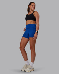 Woman wearing Genesis Layered Sports Bra - Black | Model:Phoebe | Size:S