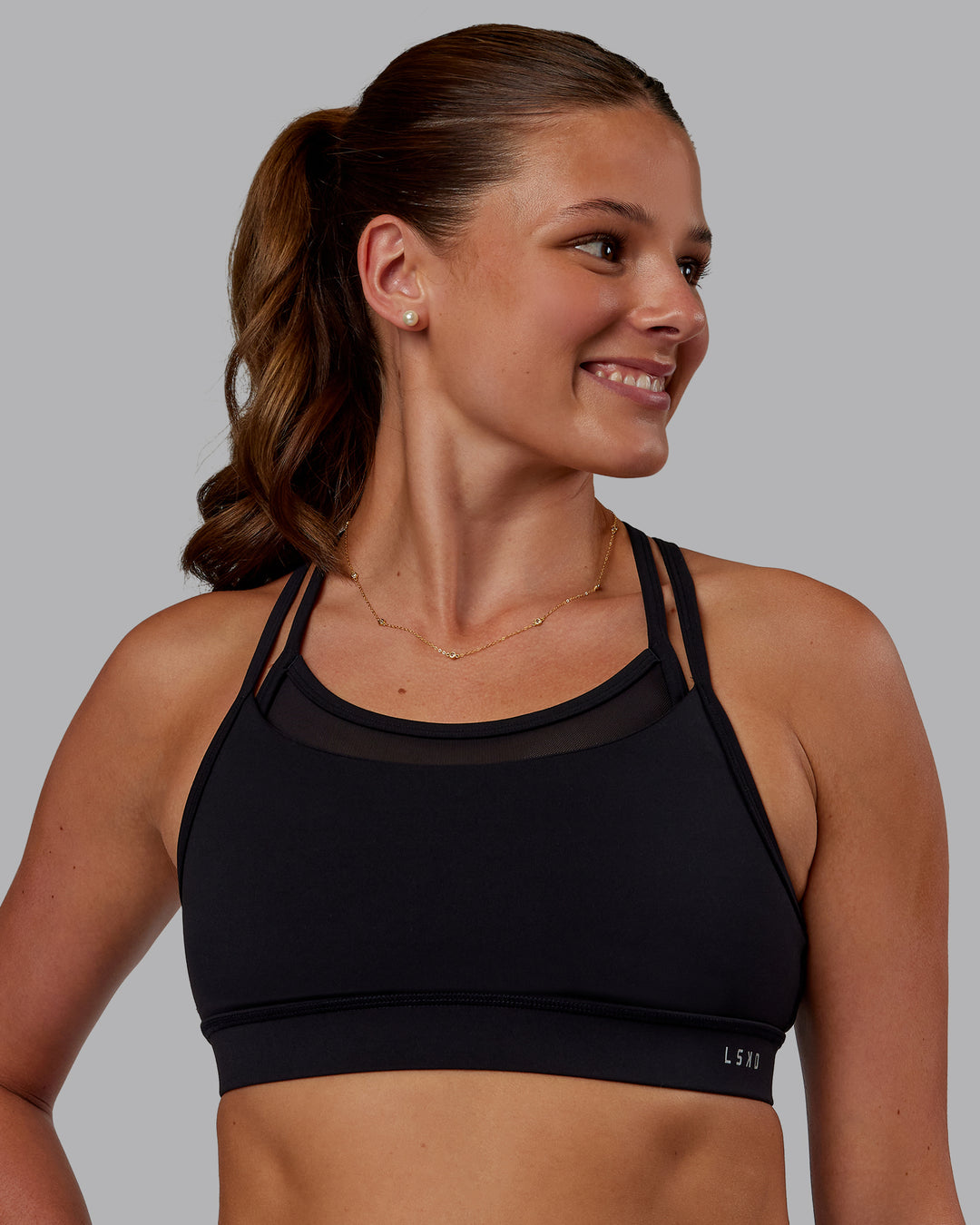 Woman wearing Genesis Layered Sports Bra - Black | Model:Phoebe | Size:S