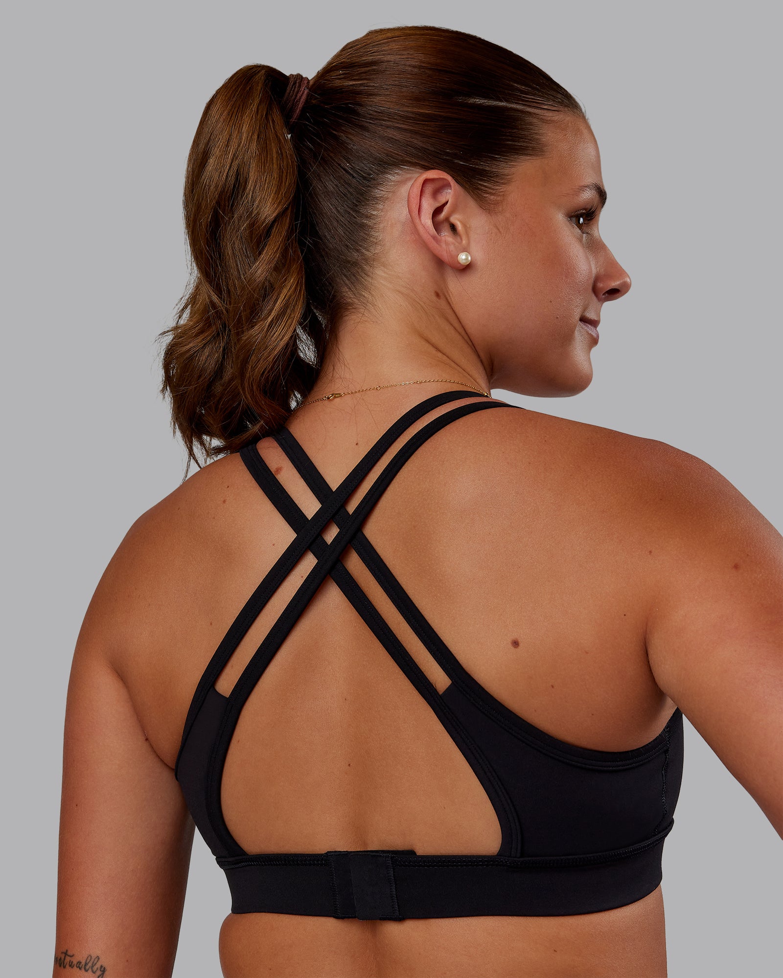 Woman wearing Genesis Layered Sports Bra - Black | Model:Phoebe | Size:S