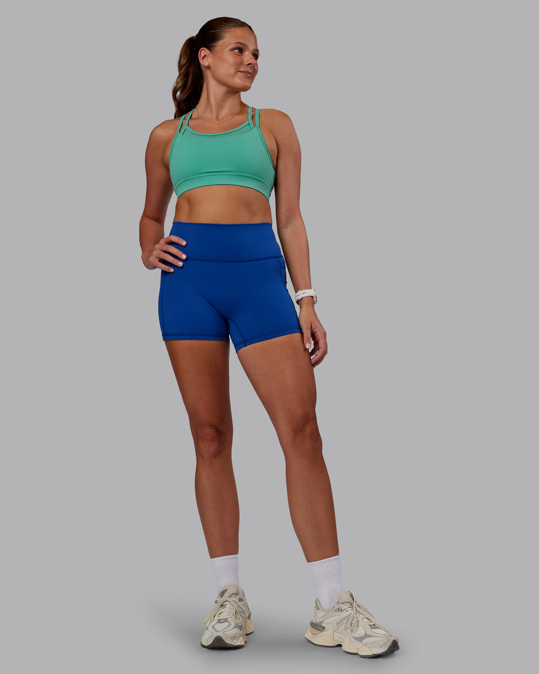 Woman wearing Genesis Layered Sports Bra - Agate Green | Model:Phoebe | Size:S