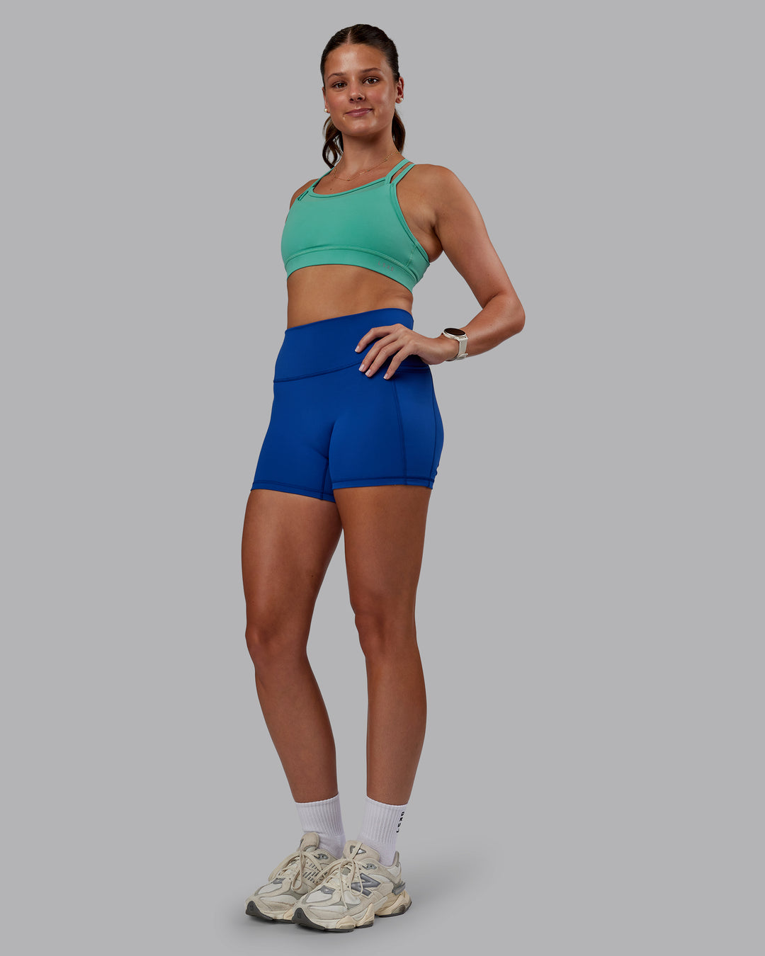 Woman wearing Genesis Layered Sports Bra - Agate Green | Model:Phoebe | Size:S