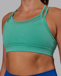 Woman wearing Genesis Layered Sports Bra - Agate Green | Model:Phoebe | Size:S
