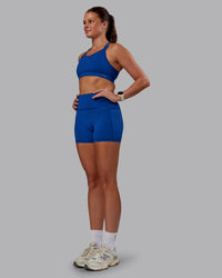 Woman wearing Genesis Layered Sports Bra - Blue Quartz | Model:Phoebe | Size:S