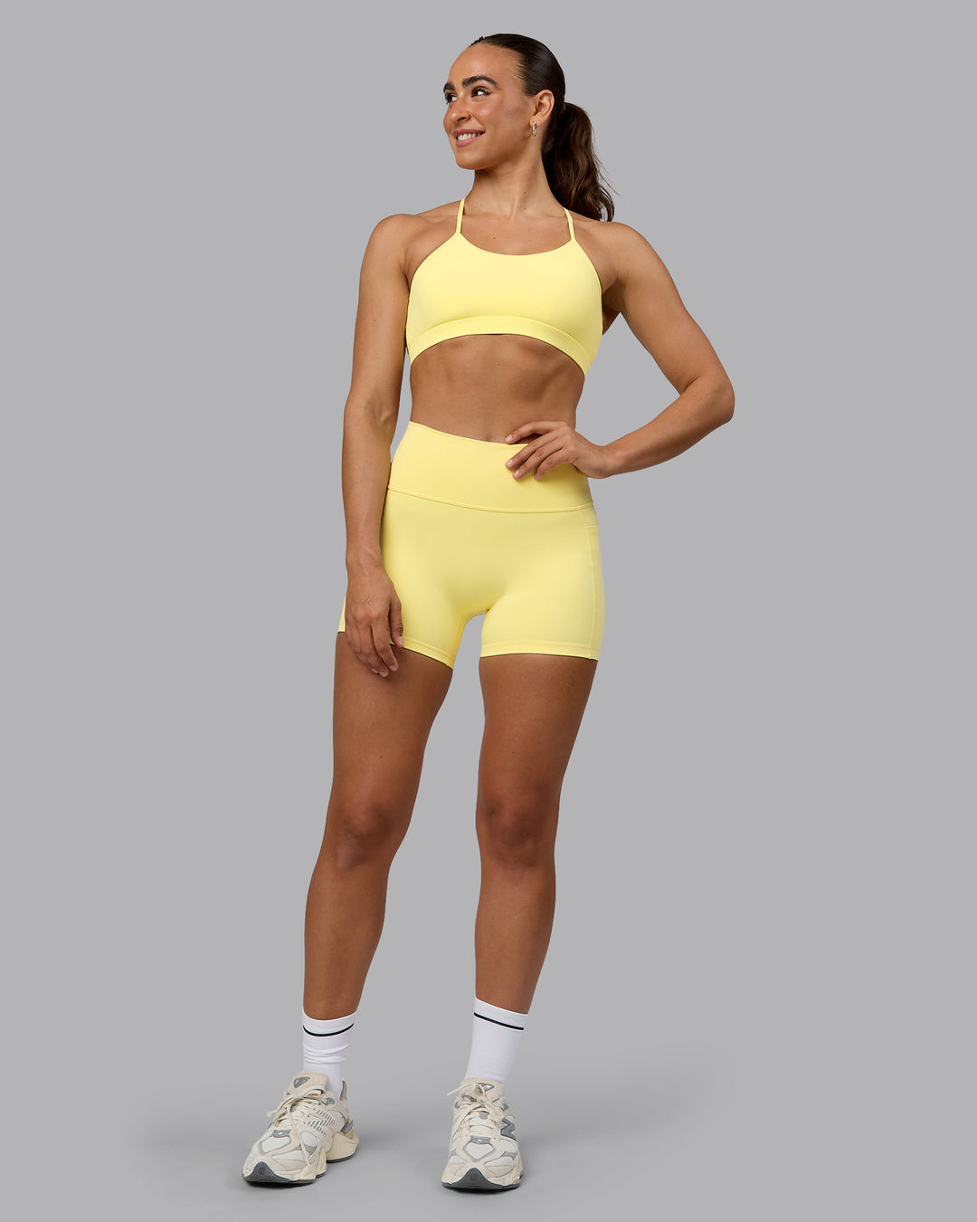 Woman wearing Glow Sports Bra - Lemon