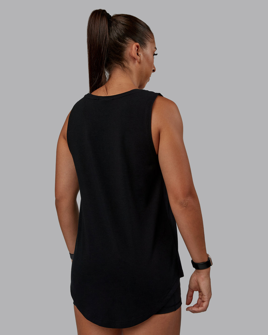 Woman wearing Go-To FLXCotton Longline Tank - Black-White | Size:S | Model:Tylah