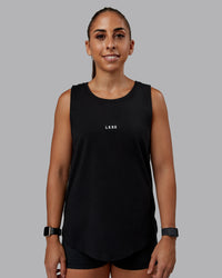 Woman wearing Go-To FLXCotton Longline Tank - Black-White | Size:S | Model:Tylah