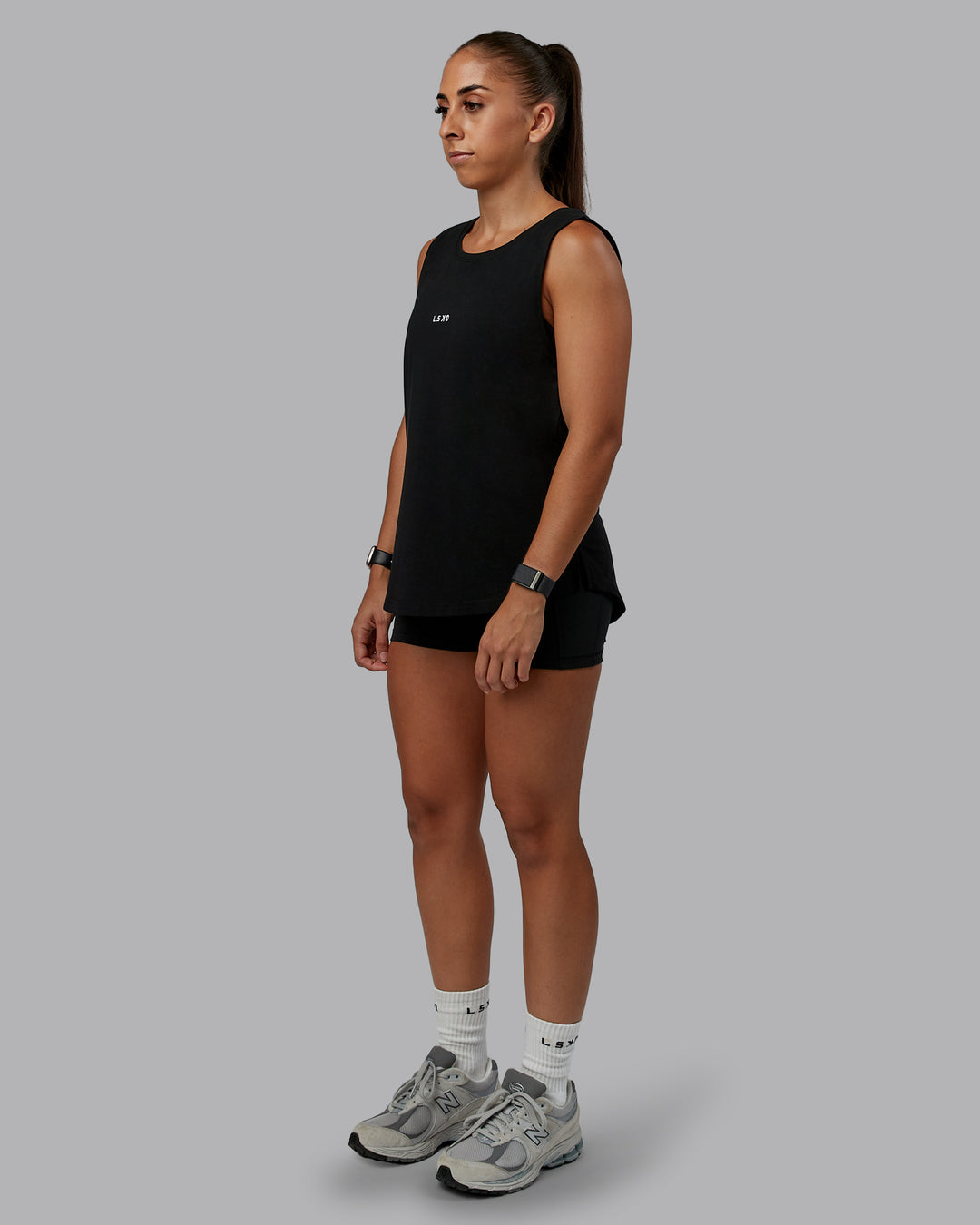 Woman wearing Go-To FLXCotton Longline Tank - Black-White | Size:S | Model:Tylah