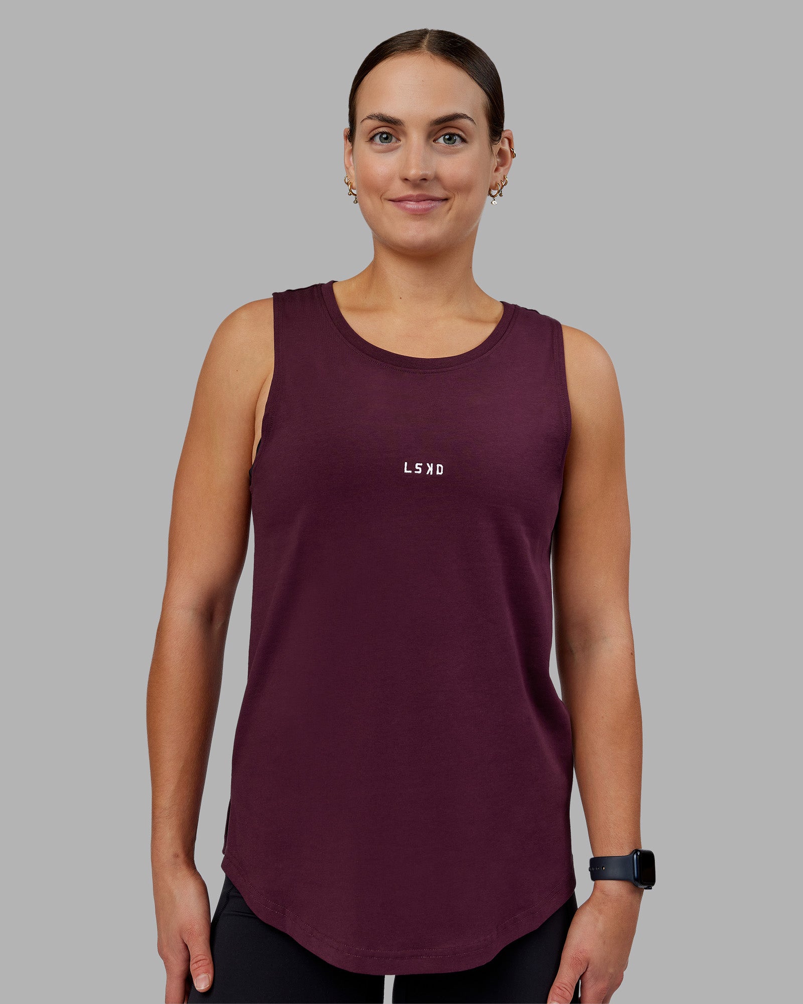 Woman wearing Go-To FLXCotton Longline Tank - Cherry Lacquer-White | Model:Keisha | Size:S