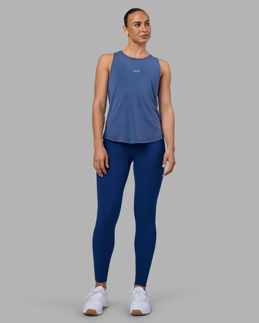 Woman wearing Go-To FLXCotton Longline Tank - Midnight Blue Washed-White | Model:Sophie | Size:S