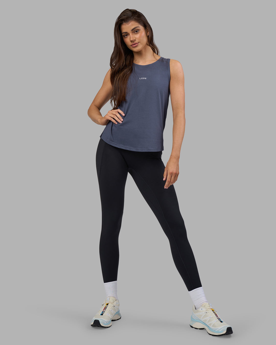 Woman wearing Go-To FLXCotton Longline Tank - Night Shadow-White | Model:Phoebe | Size:S