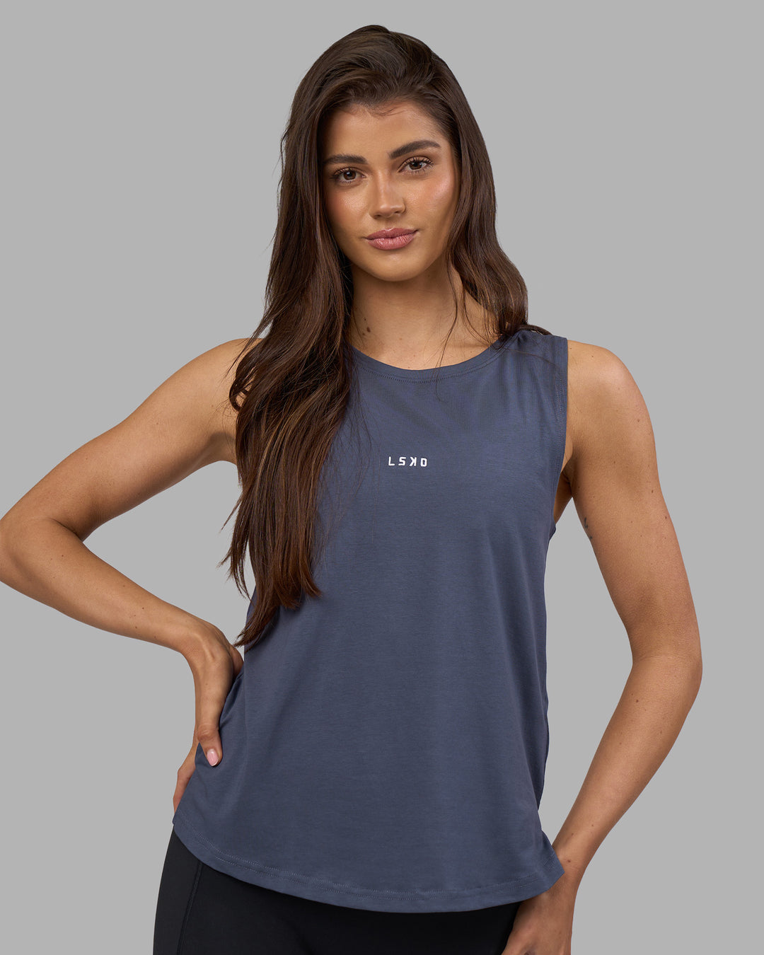 Woman wearing Go-To FLXCotton Longline Tank - Night Shadow-White | Model:Phoebe | Size:S