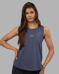 Woman wearing Go-To FLXCotton Longline Tank - Night Shadow-White | Model:Phoebe | Size:S