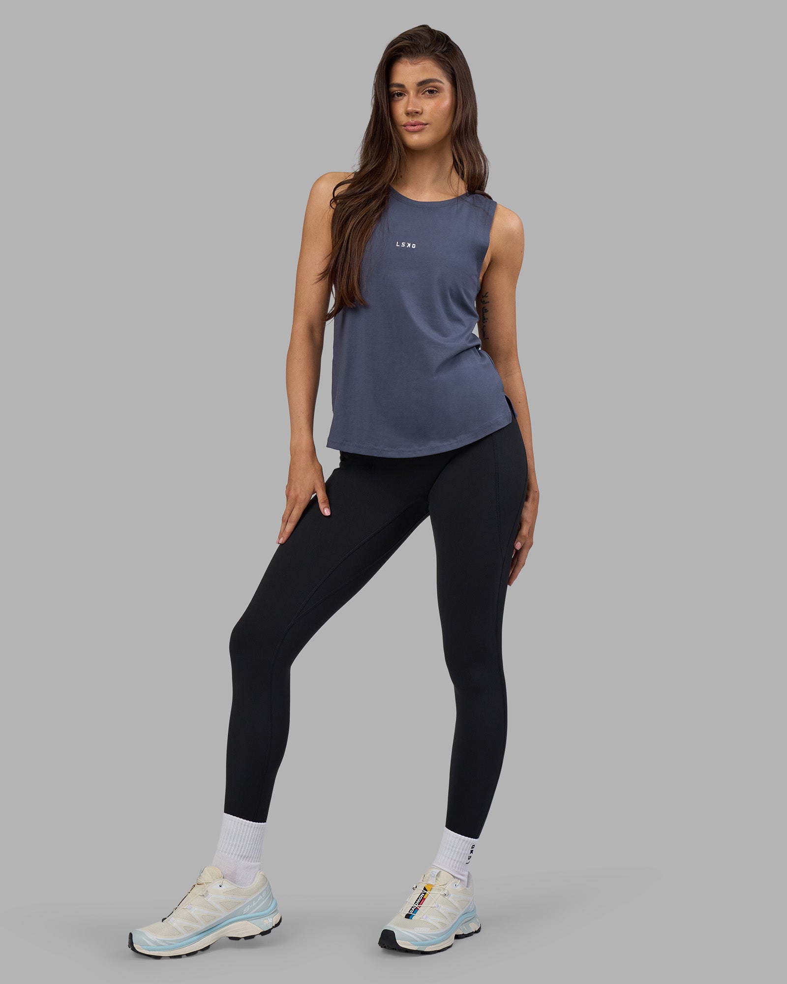 Woman wearing Go-To FLXCotton Longline Tank - Night Shadow-White | Model:Phoebe | Size:S