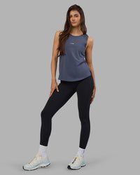 Woman wearing Go-To FLXCotton Longline Tank - Night Shadow-White | Model:Phoebe | Size:S