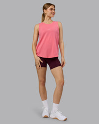 Woman wearing Go-To FLXCotton Longline Tank - Pink Lemonade-White | Model:Emilie | Size:S