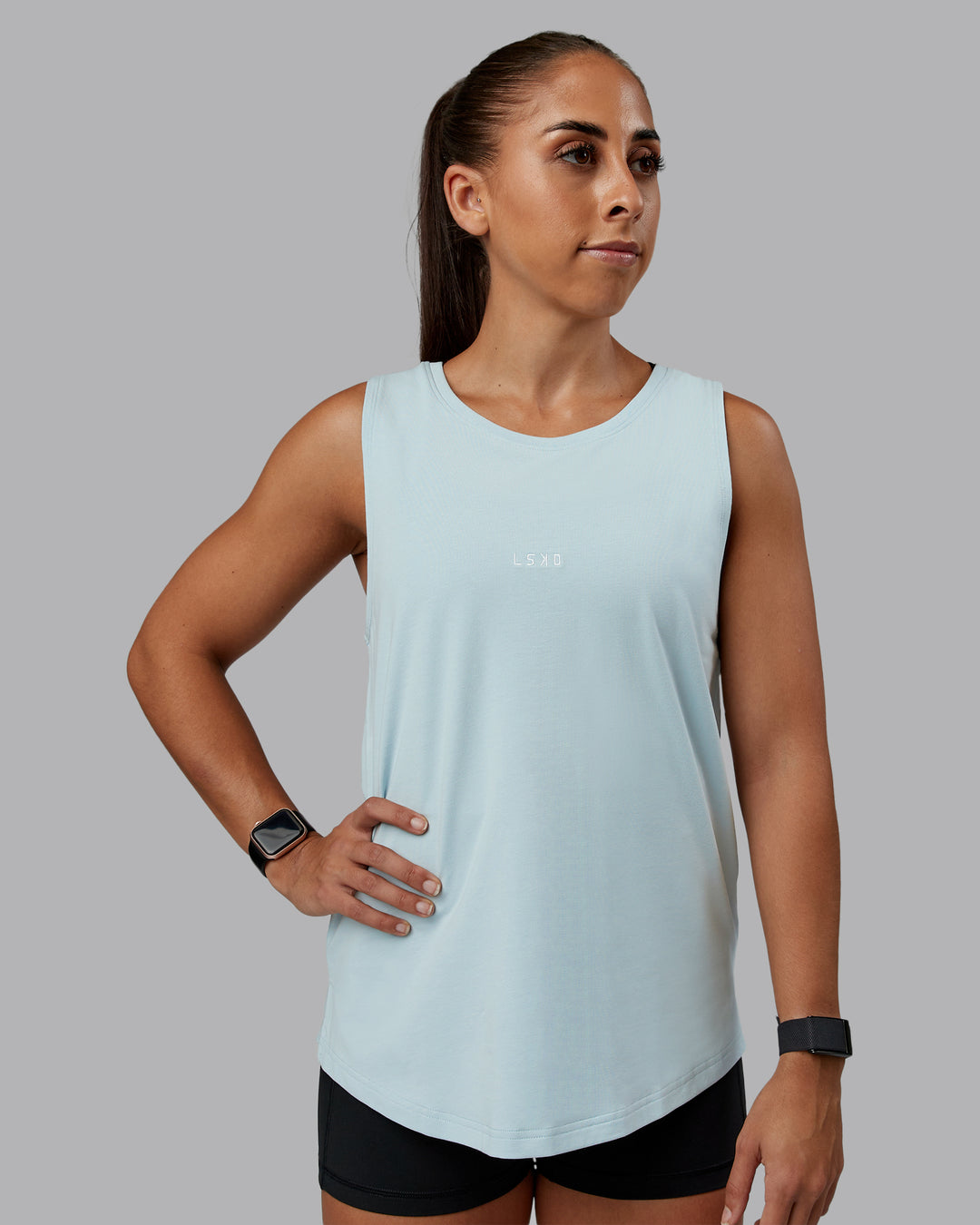 Woman wearing Go-To FLXCotton Longline Tank - Skyride-White | Size:S | Model:Tylah