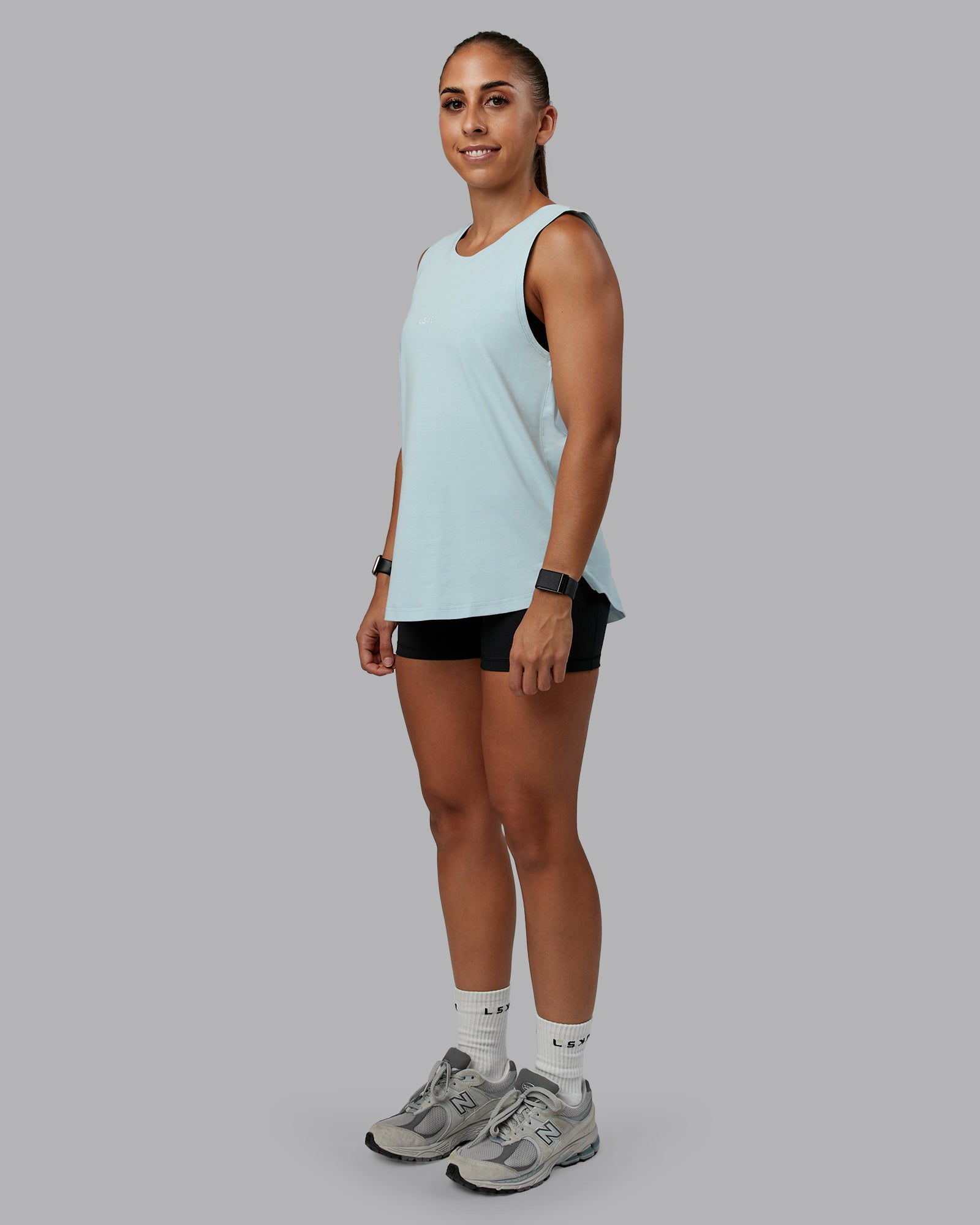 Woman wearing Go-To FLXCotton Longline Tank - Skyride-White | Size:S | Model:Tylah