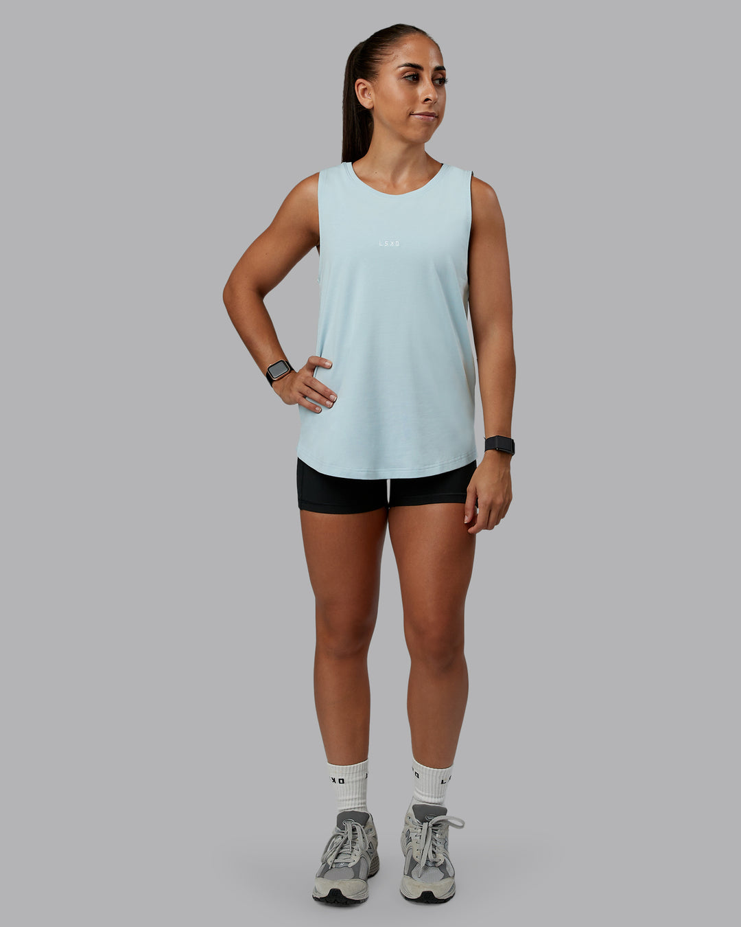 Woman wearing Go-To FLXCotton Longline Tank - Skyride-White | Size:S | Model:Tylah
