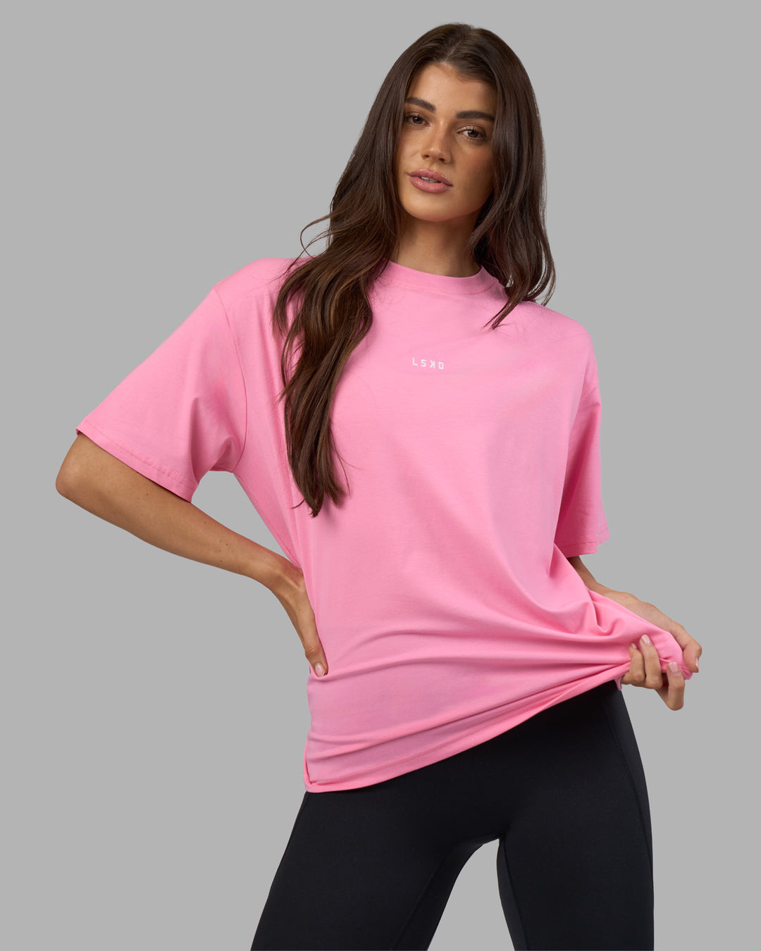 Woman wearing Go-To FLXCotton Oversized Tee - Candy Pink-White | Model:Phoebe | Size:S