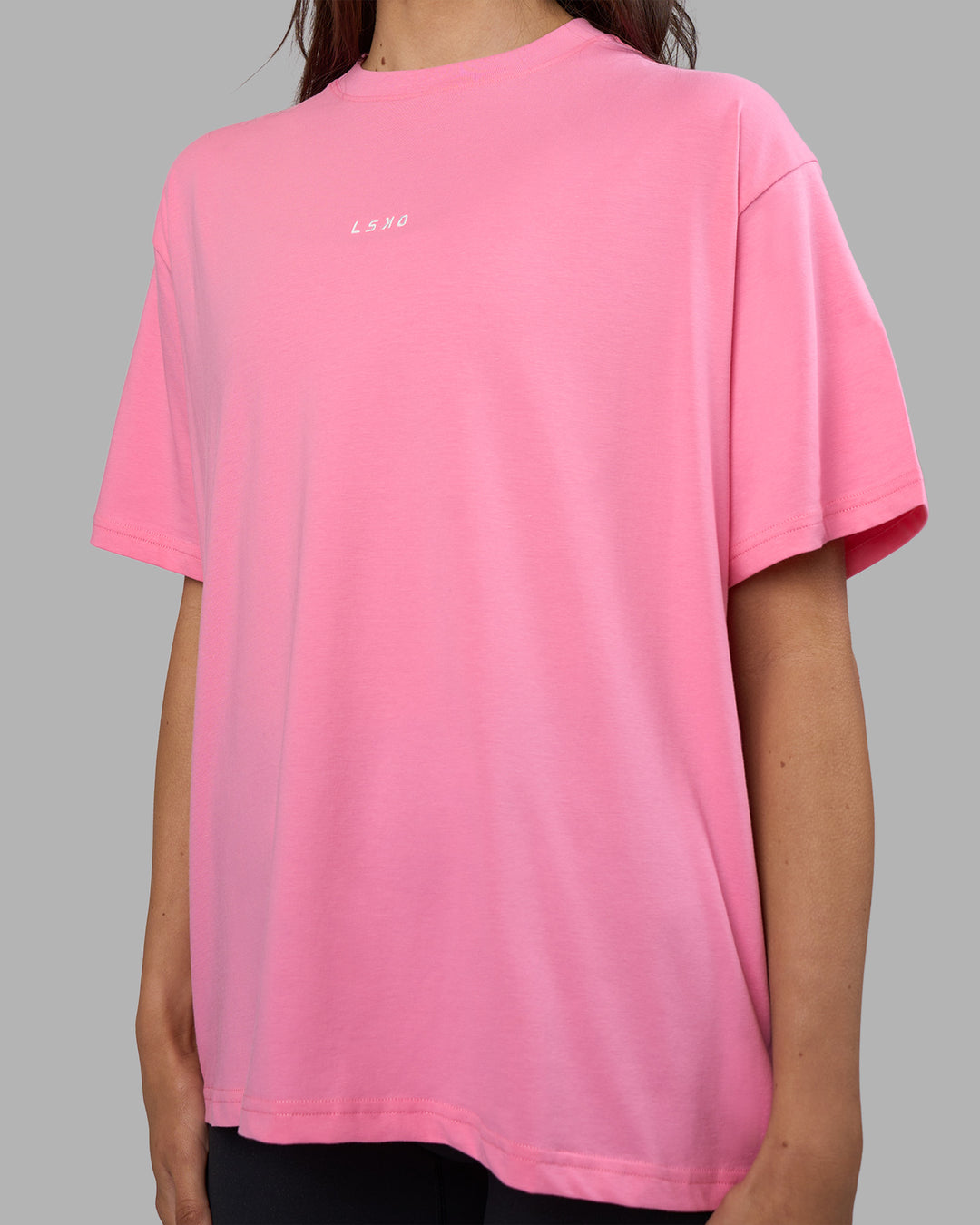 Woman wearing Go-To FLXCotton Oversized Tee - Candy Pink-White | Model:Phoebe | Size:S