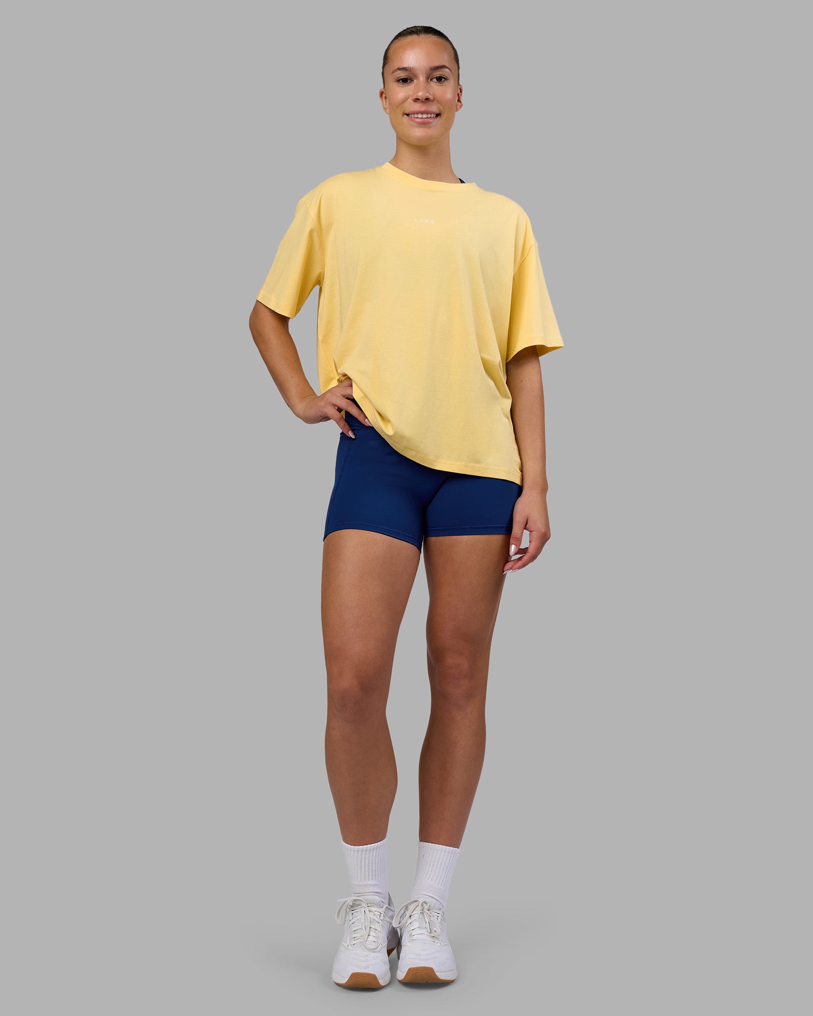 Woman wearing Go-To FLXCotton Oversized Tee - Lemon-White | Model:Charlize | Size:S